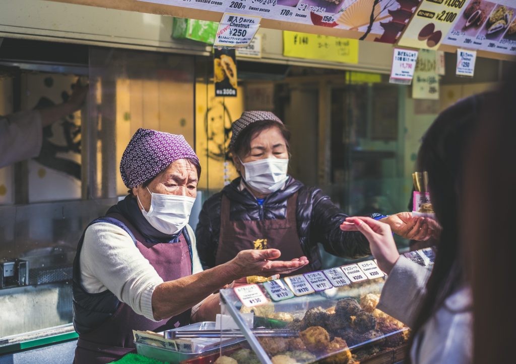 Stall vendors wearing masks