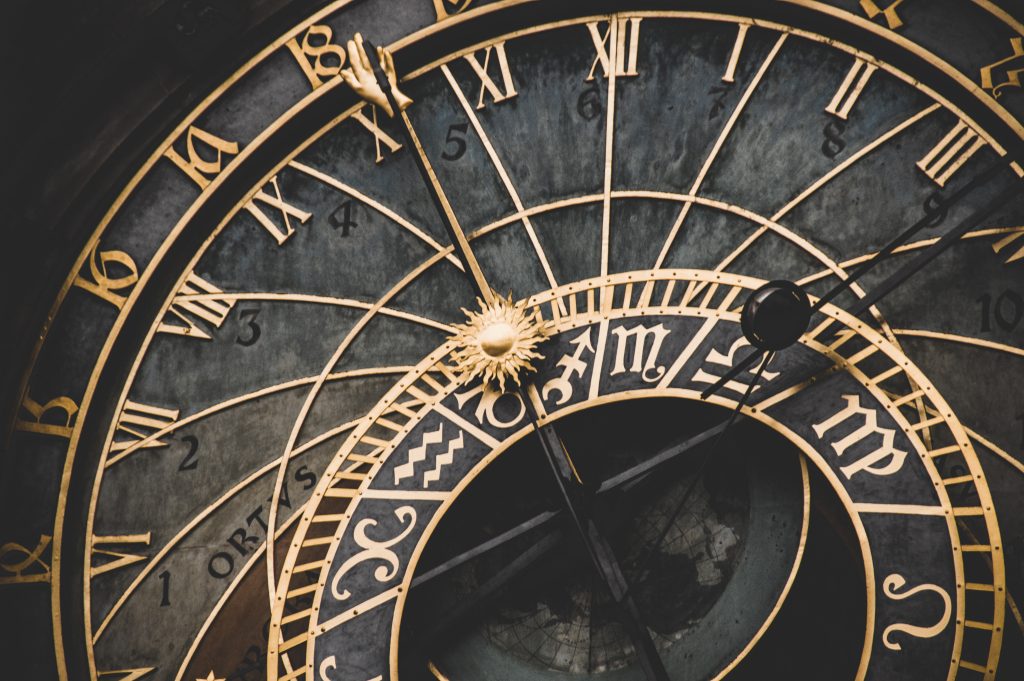 black and gold roman numeral analog clock: regular eating times helps Stomach Qi deficiency