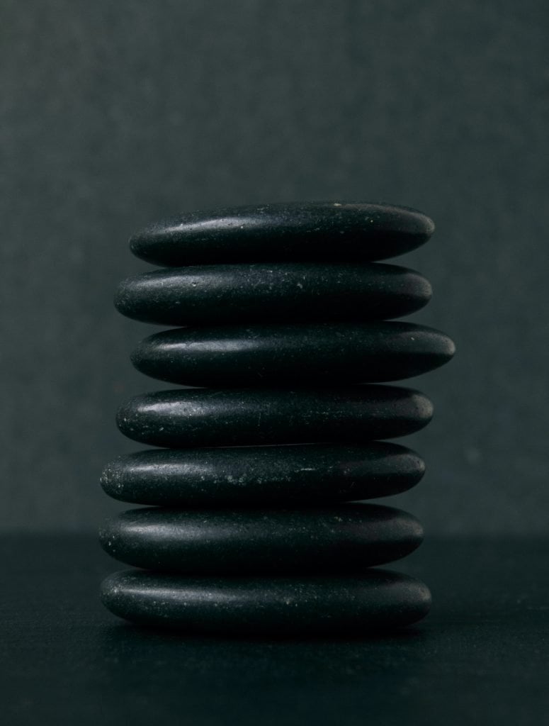 selective focus photography of seven stacked stones