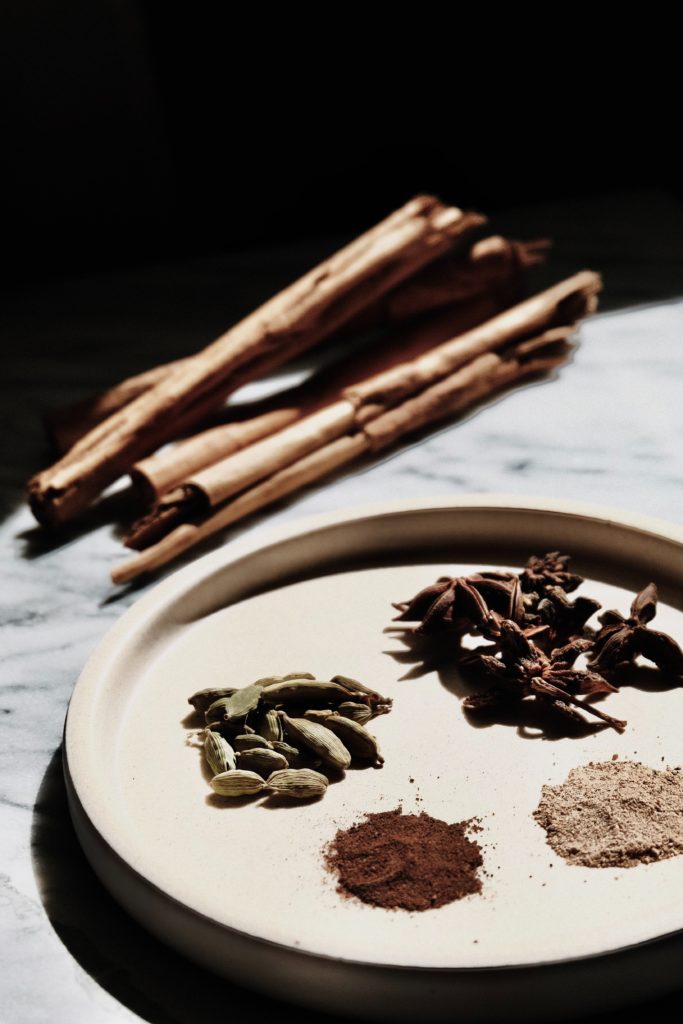 warming herbs on white ceramic round plate