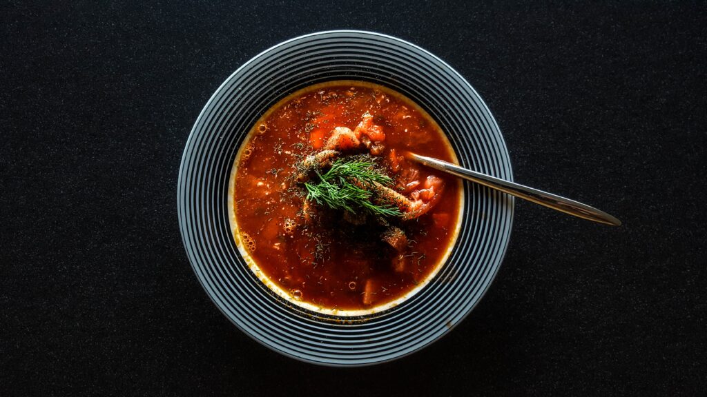 soup with vegetable on gray bowl