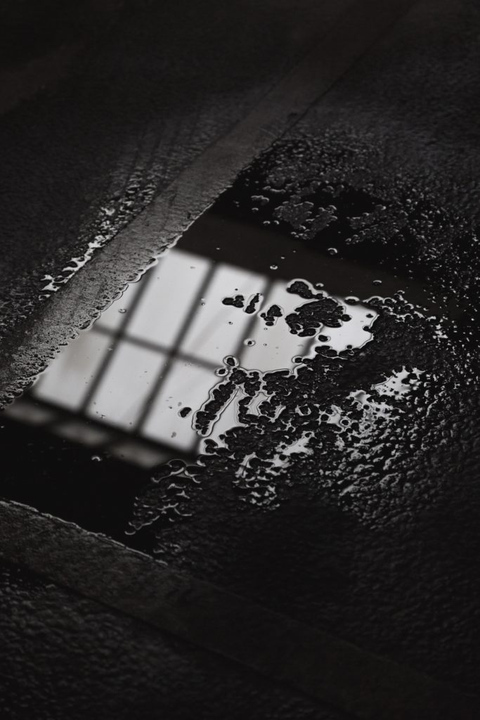water drops on gray flooring - the makings of dampness