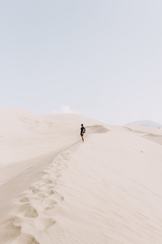person standing on sand