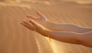 persons feet on brown sand