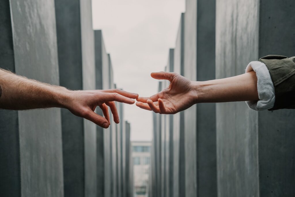 Two hands meeting lead to treatment.