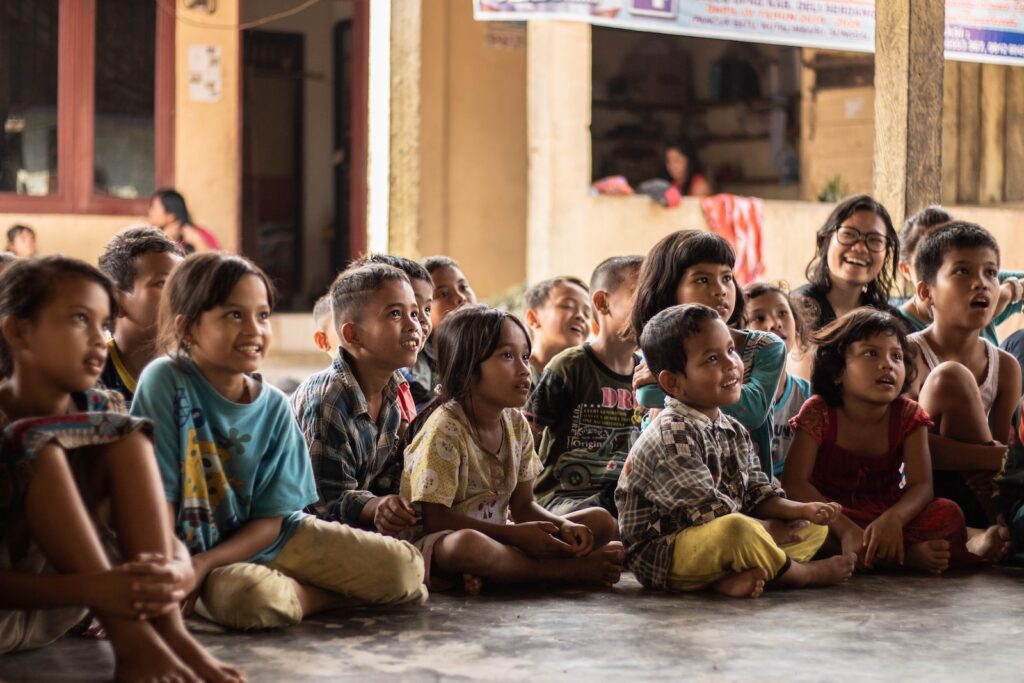 group of childrens sitting on ground: sources of yang that could be like empty wind agitating in the interior